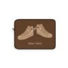 This high tops laptop sleeve features two high tops smoking joints with 'High Tops' written below in same color tan