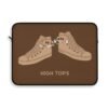 This high tops laptop sleeve features two high tops smoking joints with 'High Tops' written below in same color tan