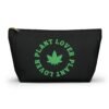 Front - 2025-11-25T220739.736 This plant lover weed leaf pouch t-bottom features a bold weed leaf design with 'Plant Lover' written around it, all in a green color same as the weed leaf itself. Weed Leaf pouch t-bottom is black