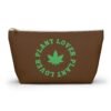 Front - 2025-11-25T220803.661 This plant lover weed leaf pouch t-bottom features a bold weed leaf design with 'Plant Lover' written around it, all in a green color same as the weed leaf itself. Weed Leaf pouch t-bottom is black
