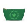 Front (54) This plant lover weed leaf pouch t-bottom features a bold weed leaf design with 'Plant Lover' written around it, all in a green color same as the weed leaf itself. Weed Leaf pouch t-bottom is green