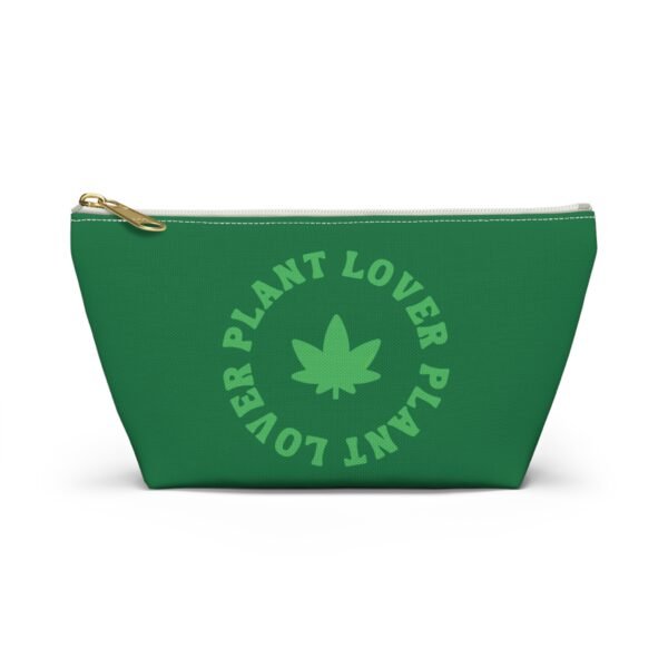 Front (54) This plant lover weed leaf pouch t-bottom features a bold weed leaf design with 'Plant Lover' written around it, all in a green color same as the weed leaf itself. Weed Leaf pouch t-bottom is green