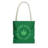 This plant lover weed leaf tote bag features a bold weed leaf design with 'Plant Lover' written around it, all in a green color same as the weed leaf itself. Weed Leaf Tote Bag is green