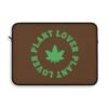 This plant lover weed leaf laptop sleeve features a bold weed leaf design with 'Plant Lover' written around it, all in a green color same as the weed leaf itself. Weed Leaf Laptop Sleeve is Brown