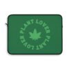This plant lover weed leaf laptop sleeve features a bold weed leaf design with 'Plant Lover' written around it, all in a green color same as the weed leaf itself. Weed Leaf Laptop Sleeve is Green