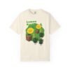 This Lemon Kush T-shirt features two weed leaves two lemons standing on boxes squirting lemon juice on weed plants like they are peeing on them. "Lemon Kush is written above the lemons with a green background.