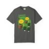 This Lemon Kush T-shirt features two weed leaves two lemons standing on boxes squirting lemon juice on weed plants like they are peeing on them. "Lemon Kush is written above the lemons with a green background.