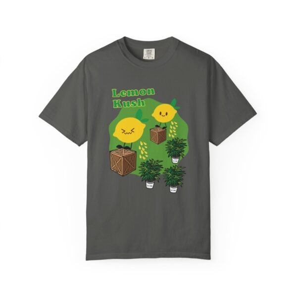 This Lemon Kush T-shirt features two weed leaves two lemons standing on boxes squirting lemon juice on weed plants like they are peeing on them. "Lemon Kush is written above the lemons with a green background.