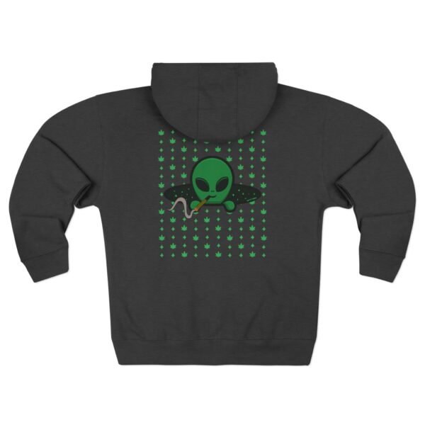 Green Alien Portal Zip up features a green alien popping out of a black hole smoking a blunt. weed pattern behind alien