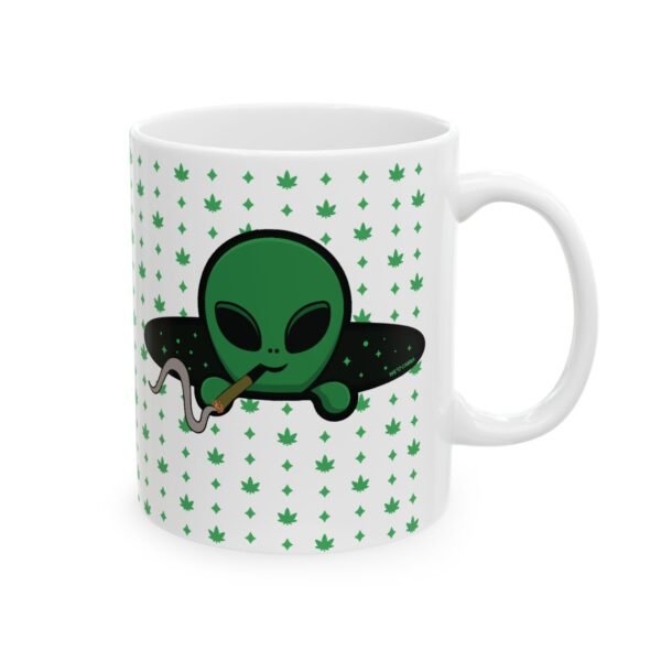Green Alien Portal Mug features a green alien popping out of a black hole smoking a blunt. weed pattern behind alien
