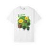 This Lemon Kush T-shirt features two weed leaves two lemons standing on boxes squirting lemon juice on weed plants like they are peeing on them. "Lemon Kush is written above the lemons with a green background.