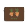 This high thymes laptop sleeve features two thyme plants smoking joints with 'High Thymes' written below in green