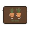 This high thymes laptop sleeve features two thyme plants smoking joints with 'High Thymes' written below in green